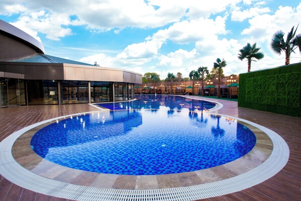 Indoor pool, outdoor pool, free pool cabanas, pool umbrellas