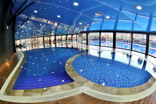 Indoor pool, outdoor pool, free pool cabanas, pool umbrellas