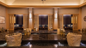 A spacious lobby with a marble floor, seating areas, and a large chandelier. - Rixos Water World Aktau (Aktau)