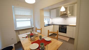 Apartment | Private kitchen | Fridge, oven, stovetop, dishwasher