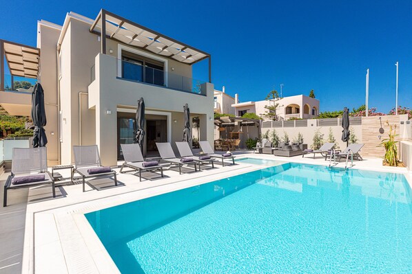 Outdoor pool, a heated pool, pool loungers
