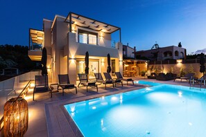 Outdoor pool, a heated pool, pool loungers