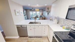 Condo, 2 Bedrooms | Private kitchen - Seacrest 413 is a 2 BR Gulfside on Okaloosa Island by RedAwning (Fort Walton Beach)