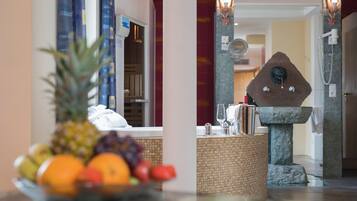 Fresh fruit and warm hospitality await at the reception area, where a welcoming space offers a comfortable spot to relax.