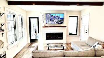Smart TV, fireplace, books, printers