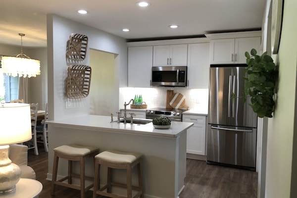 Full Kitchen. Stainless appliances. Large shelves in Pantry. Lots of lighting.