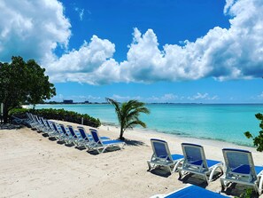 On the beach, sun-loungers, beach umbrellas, beach towels