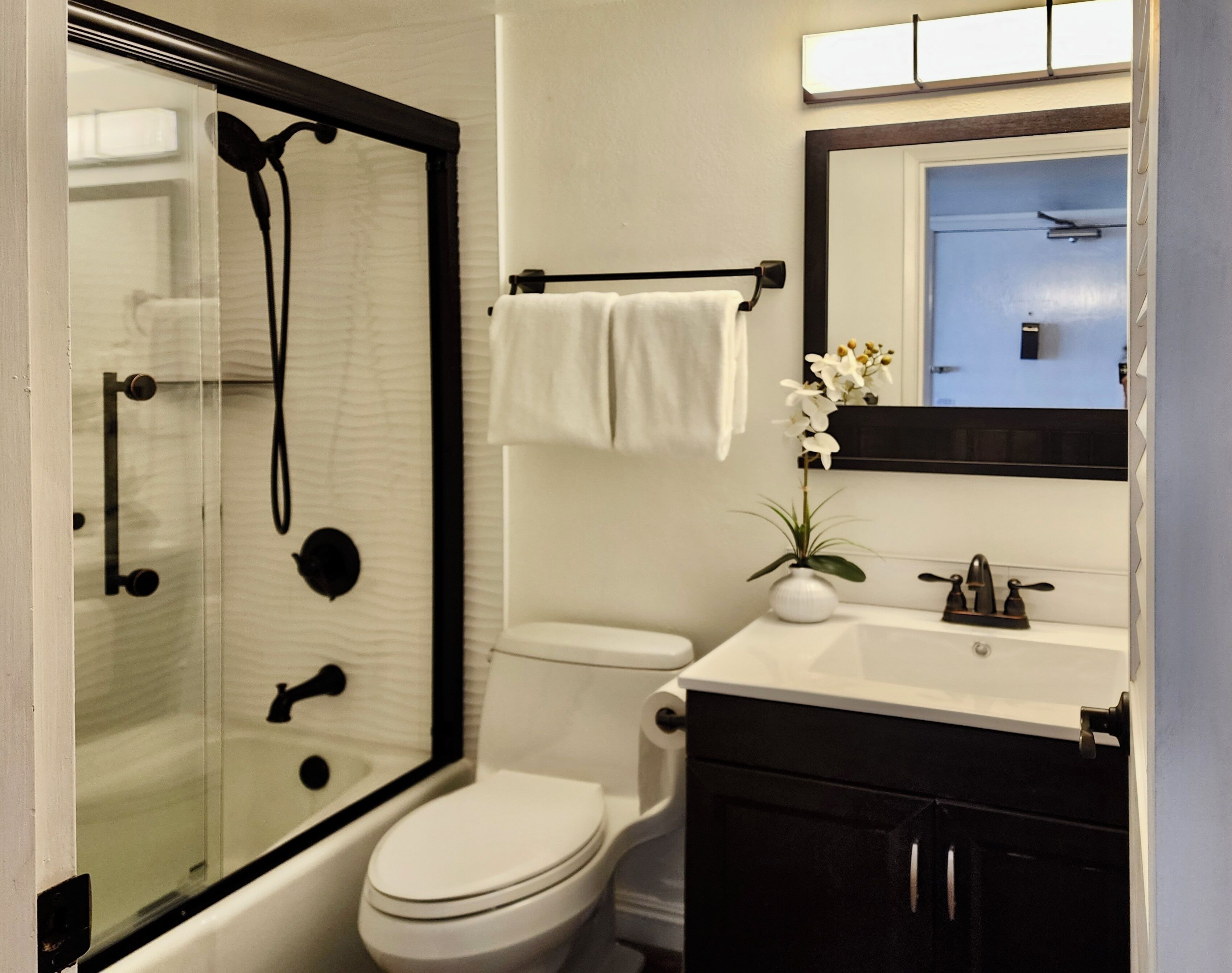 Bathtub, hair dryer, towels