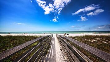 On the beach, sun loungers, beach towels