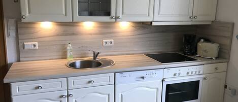 Microwave, stovetop, dishwasher, coffee/tea maker