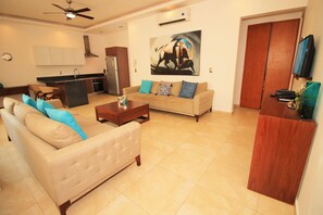 Departamento Confort | Sala de estar | Televisión de pantalla plana 