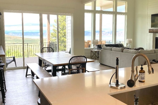 Open concept kitchen, eating and family area with deck view/access