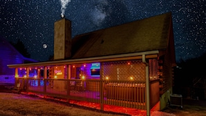 A wooden building with a covered porch, a chimney, and a sign that reads "Good vibes." - 5min Dollywood~Easy Road~FirePit~Arcade~Playground (Sevierville)