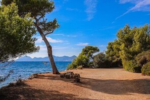 On the beach, sun-loungers, beach towels