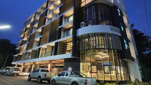 A multi-story hotel with a modern design, featuring balconies and large windows. - Good Dream Premier (Hat Yai)