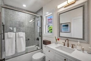 Bathtub, hair dryer, towels