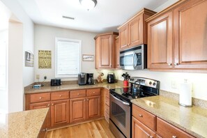 Dishwasher, coffee/tea maker, cookware/dishes/utensils
