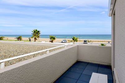 A seafront dream with garden and private parking.