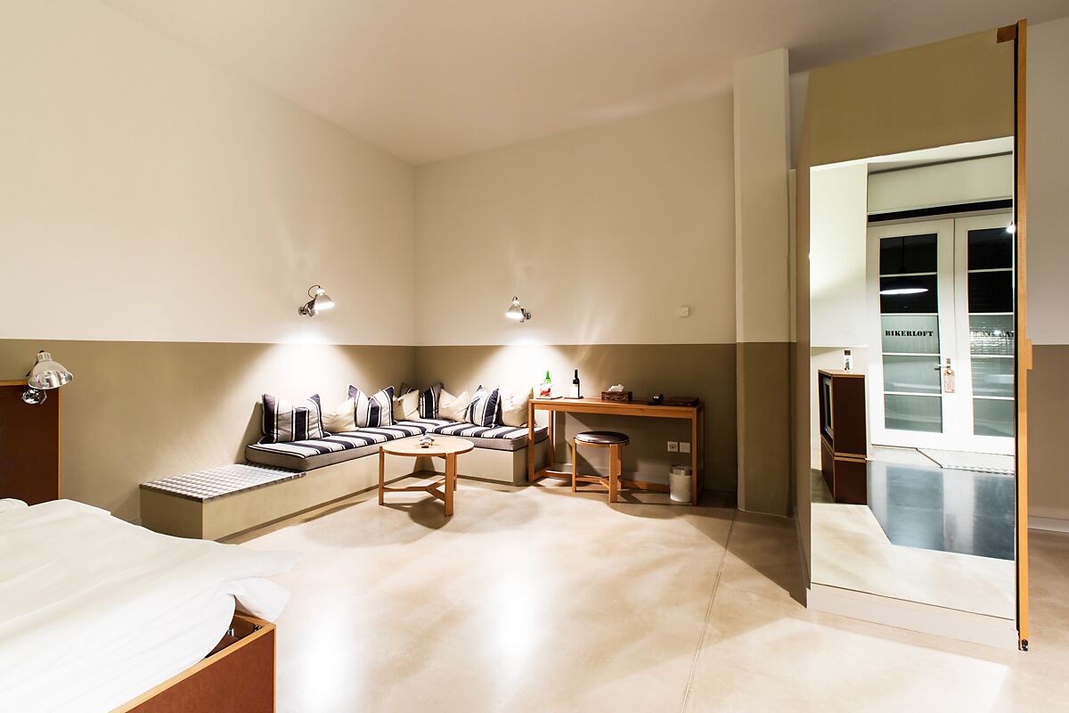 design double room (biker theme) | living area | ipod dock, table football, ping pong