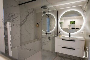 Shower, eco-friendly toiletries, hair dryer, towels