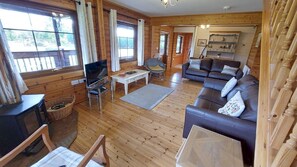 TV, fireplace - Eirianfa -  a scandinavian lodge that sleeps 6 guests  in 3 bedrooms (Menai Bridge)