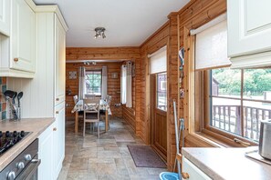 Fridge, microwave, oven, cookware/dishes/utensils - Eirianfa -  a scandinavian lodge that sleeps 6 guests  in 3 bedrooms (Menai Bridge)