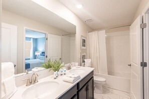 Shower, hair dryer, towels, toilet paper