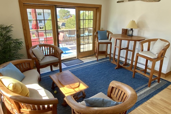 2nd Floor: bistro with sliders to the deck and large yard below.