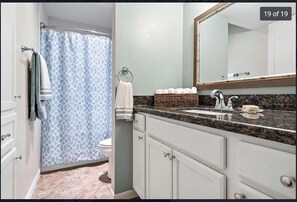 Combined shower/bathtub, hair dryer, towels, soap