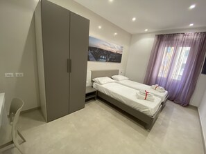 2 bedrooms, desk, iron/ironing board, travel cot