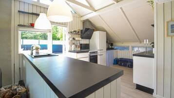 Fridge, stovetop, dishwasher, coffee/tea maker