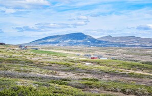 Surrounded by rugged mountains and sparse vegetation, this remote settlement offers a serene escape.