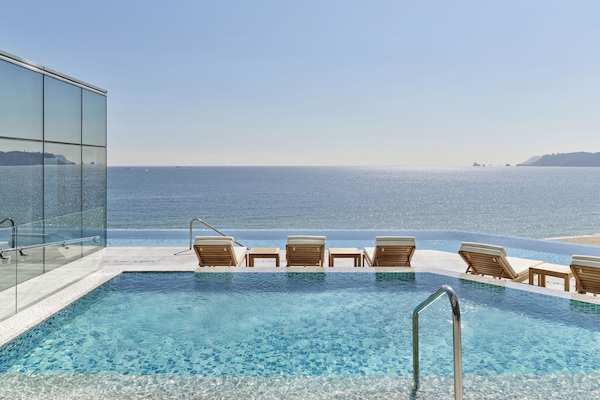 Indoor pool, outdoor pool, open 6:00 AM to 10:00 PM, sun loungers