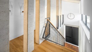 A modern interior with a concrete staircase, wooden flooring, and a fireplace. - Beautiful home in Barban (Barban)