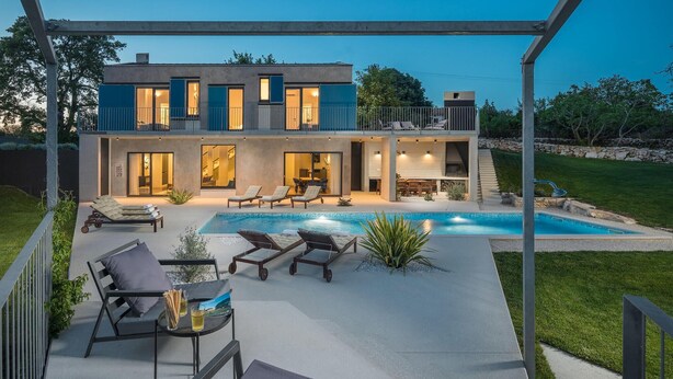 A modern two-story house with a swimming pool, outdoor seating, and a covered patio area. - Beautiful home in Barban (Barban)