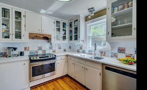 Microwave, dishwasher, coffee/tea maker, cookware/dishes/utensils