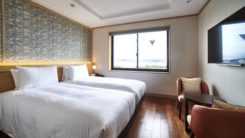 Habitación estándar, 2 camas individuales, para no fumadores, vista parcial al océano | Caja de seguridad en la habitación, insonorización y wifi gratis