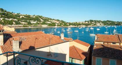 26. A colorful apartment with a beautiful sea view and a balcony