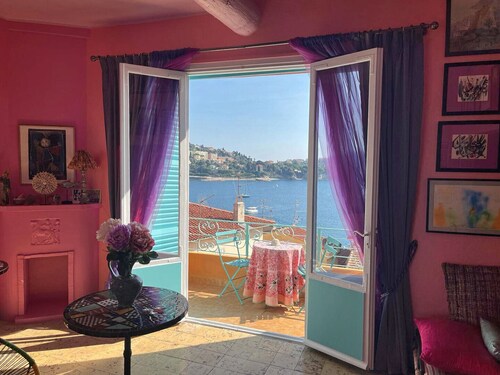 26. A colorful apartment with a beautiful sea view and a balcony
