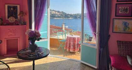 26. A colorful apartment with a beautiful sea view and a balcony