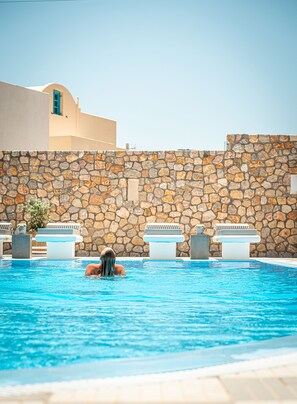 Seasonal outdoor pool, open 9:00 AM to 10:00 PM, pool umbrellas