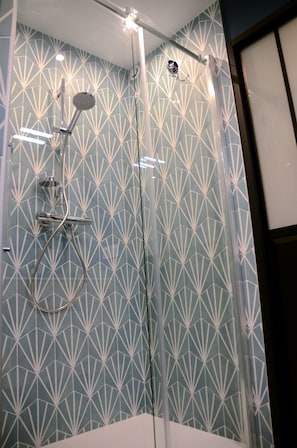 Shower, hair dryer, towels, soap