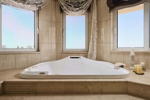 Bathtub, jetted bath, hair dryer, towels