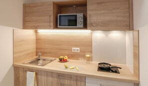 Fridge, microwave, stovetop, cookware/dishes/utensils