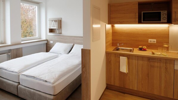 Desk, laptop workspace, free WiFi, bed sheets