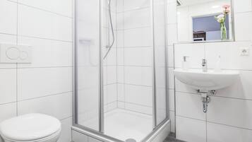 Shower, towels, soap, toilet paper