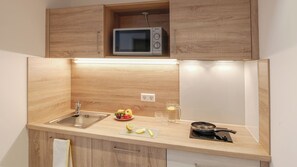 Fridge, microwave, stovetop, cookware/dishes/utensils