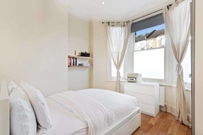 2 bedrooms, desk, laptop workspace, iron/ironing board
