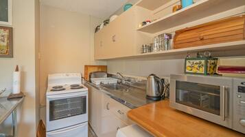 Fridge, microwave, toaster, cookware/dishes/utensils