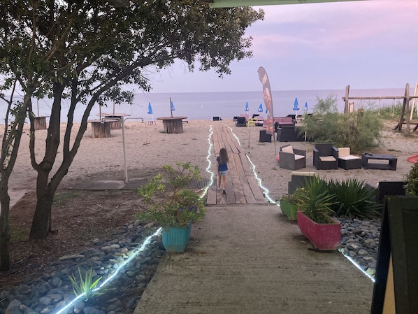 On the beach, sun-loungers